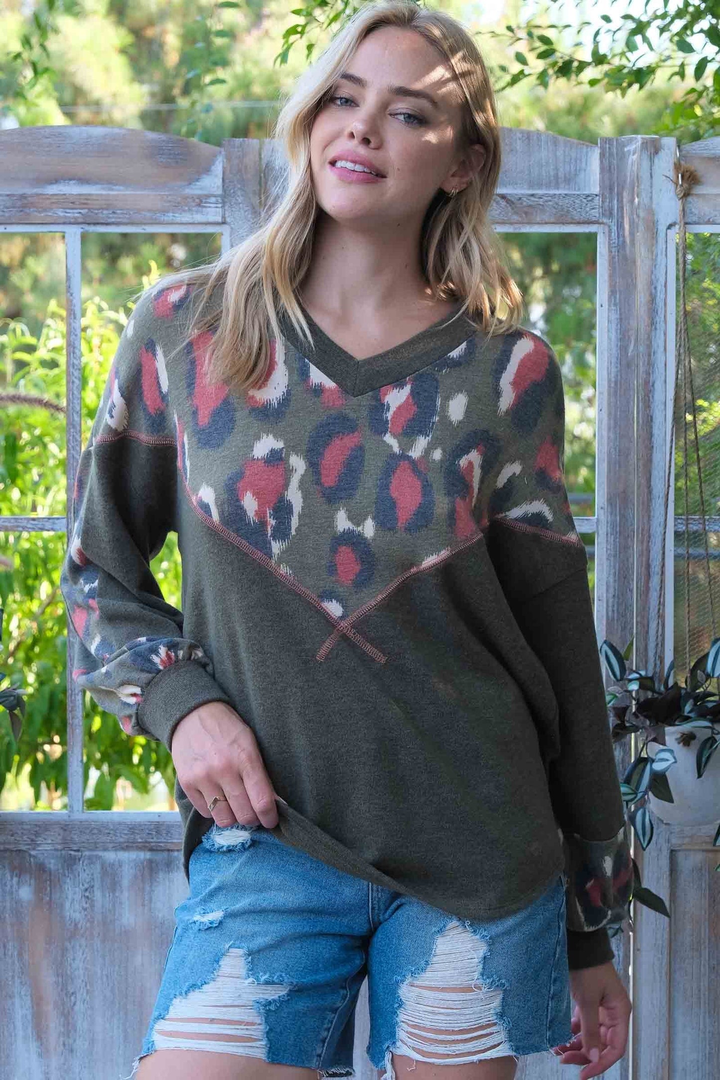 Animal printed and solid knit V shape panel top