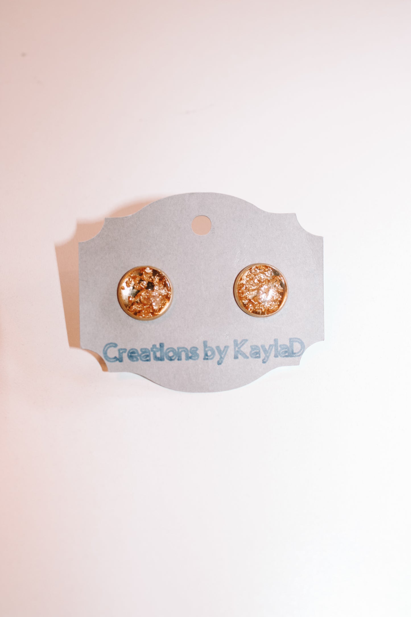 #104 gold flakes studs