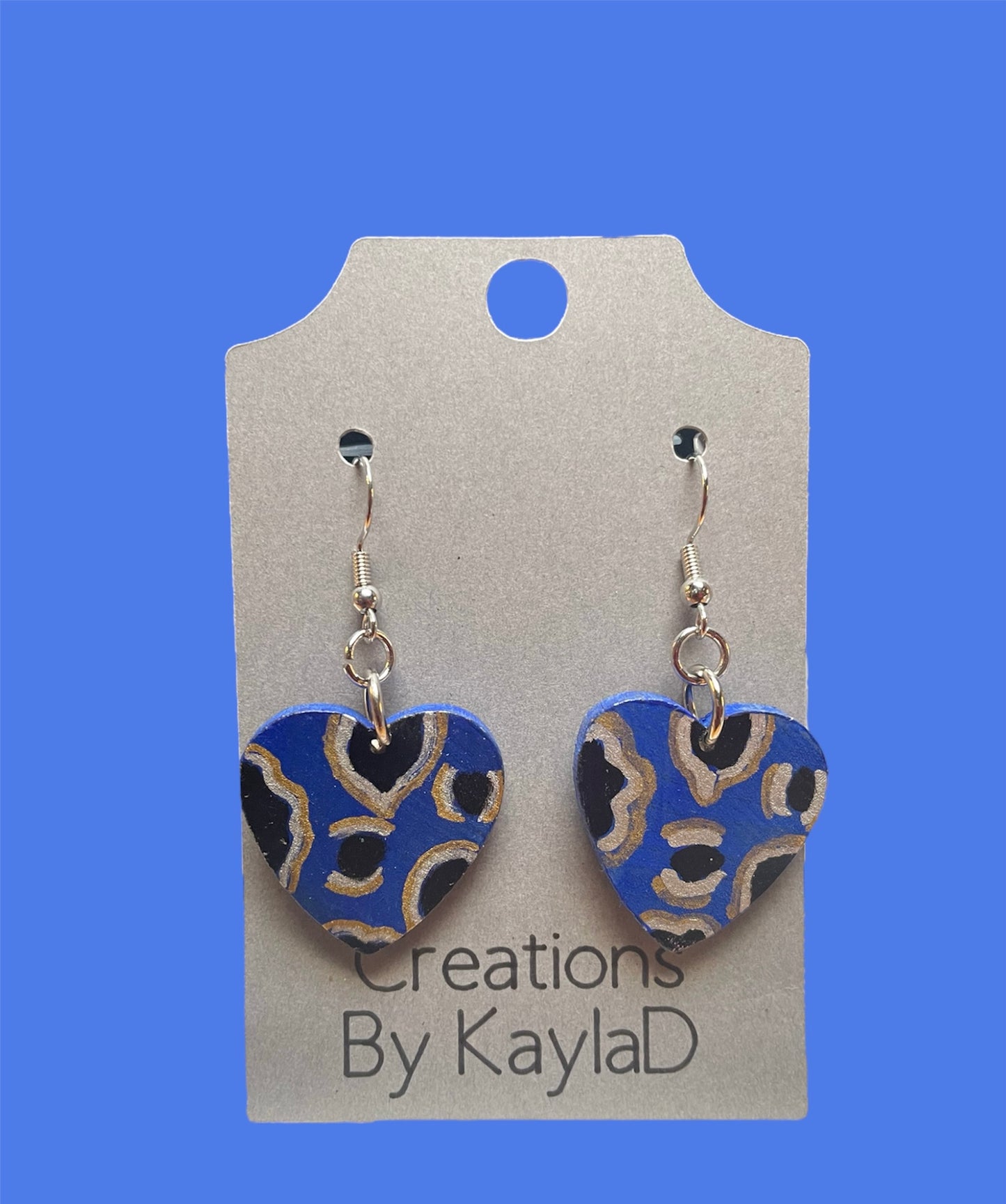 #224 blue cheetah heart earrings